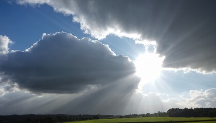 Fototapeta premium cloudy sky with sunlight breaking through in the distance