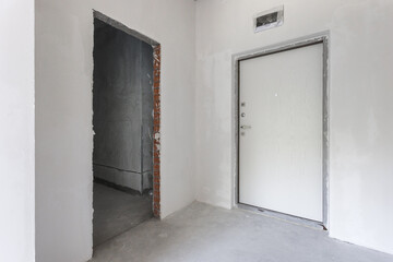 interior of the apartment without decoration in gray colors. rough finish