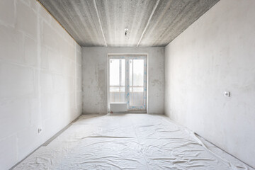 interior of the apartment without decoration in gray colors. rough finish