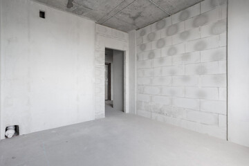 interior of the apartment without decoration in gray colors. rough finish