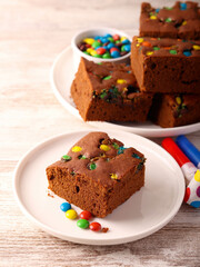 Chocolate cake bars with coated candies
