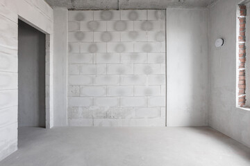 interior of the apartment without decoration in gray colors. rough finish