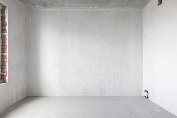 interior of the apartment without decoration in gray colors. rough finish