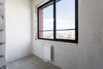 interior of the apartment without decoration in gray colors. rough finish