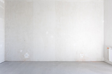 interior of the apartment without decoration in gray colors. rough finish