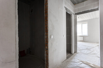 interior of the apartment without decoration in gray colors. rough finish