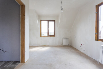 interior of the apartment without decoration in gray colors. rough finish