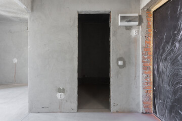 interior of the apartment without decoration in gray colors. rough finish