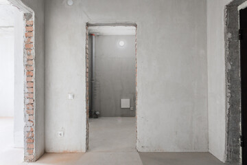 interior of the apartment without decoration in gray colors. rough finish