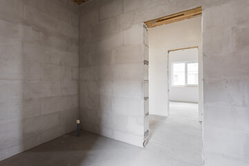 interior of the apartment without decoration in gray colors. rough finish