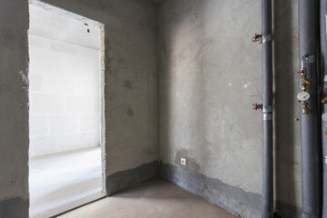 interior of the apartment without decoration in gray colors. rough finish