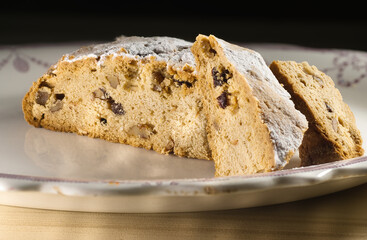 Traditional German Christmas Stollen Bread with Nuts and Raisins Sliced to Show InteriorDSC00641_stack