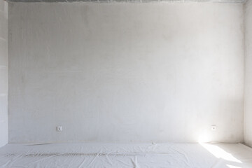 interior of the apartment without decoration in gray colors. rough finish