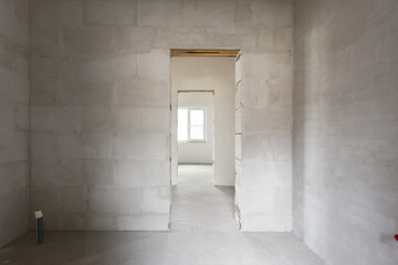 interior of the apartment without decoration in gray colors. rough finish