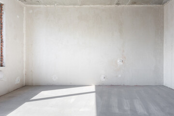 interior of the apartment without decoration in gray colors. rough finish