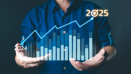 Businessmen touch target 2025 and progress of business and analyze financial, and investment.Use technology to plan strategy to success goals and growth.online business, e-commerce, online marketing.