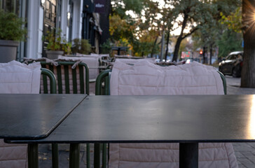 Cafe table on the street, abstract background.
