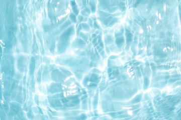 Closeup Transparent blue clear water surface texture with ripples. Abstract​ of​ surface​ blue​ splashes and bubbles​ water waves  reflected​ with​ sunlight​