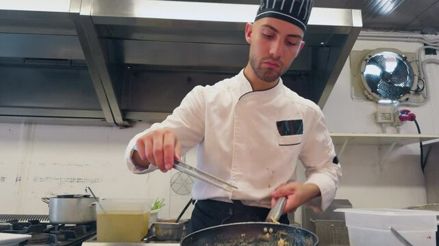 Plating Of A Raw And Cooked Fish Based Appetizer In A Luxury Italian Kitchen