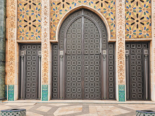view of Hassan II mosque's big gate full of beautiful moroccan mosaic pattern, Detail of Hassan 2 Mosque in Casablanca, Morocco