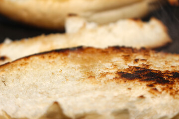 close up of bread. toasted bread with butter. bread details. bread with selective focus.