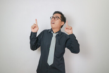 young asian men wearing black shirt pointing up copy space