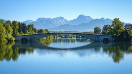 Fototapeta premium Tranquil Lake with Bridge and Mountain Reflections