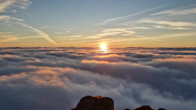 Breathtaking Sunrise Above the Clouds on Snowdon Summit, Snowdonia National Park in Wales