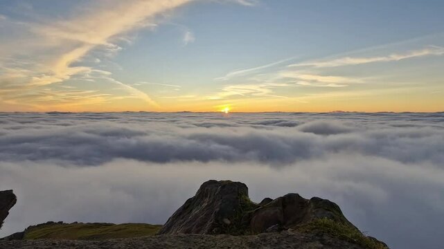 Breathtaking Sunrise Above the Clouds on Snowdon Summit, Snowdonia National Park in Wales