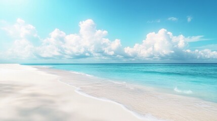 Fototapeta premium A beautiful beach with a clear blue ocean and a few clouds in the sky