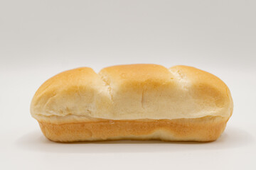 Close up of a fresh bun bread on a white background, baking dough goods 