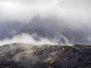 A typical autumn foggy landscape in the Khibiny Mountains in early autumn on the Kola Peninsula in the Arctic Circle