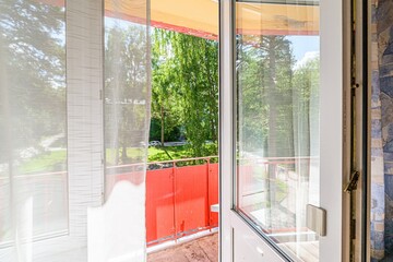 interior apartment room balcony overlooking the street
