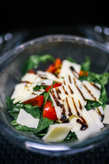 Healthy organic salad packed in a plastic container.
