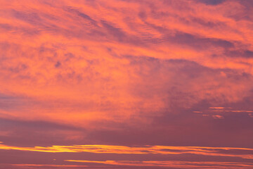 A stunning sunrise sky with vibrant shades of pink, orange, and hints of purple.