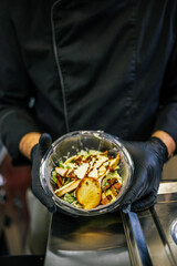 Healthy organic salad packed in a plastic container.