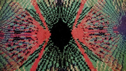 The carpet texture is red, green and black
