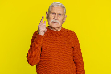 Quarrel. Displeased aggressive unhappy senior old man gesturing hands with irritation and...