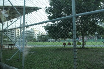 highschool field through fence