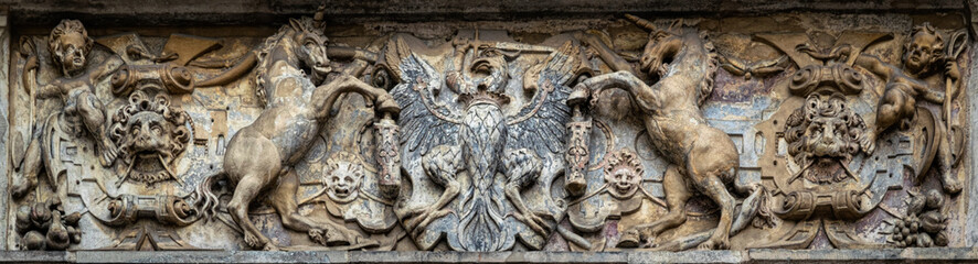 Medieval stone panel with unicorns and royal coat of arms