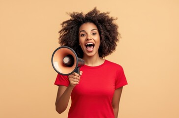 Obraz premium Woman in Red Shirt Holding a Megaphone with Excited Expression