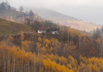 Autumn landscape from Transylvania, Romania. Village from Carpathian Mountains on a cloudy day.