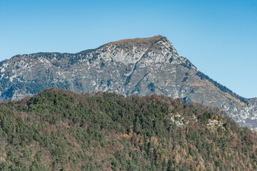 Peaks of Friuli Venezia Giulia above Illegio: Mountain Landscape with Winter Colors and Clear Sky, Atmosphere of Peace and Tranquility.