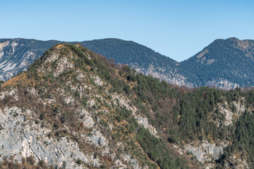 Peaks of Friuli Venezia Giulia above Illegio: Mountain Landscape with Winter Colors and Clear Sky, Atmosphere of Peace and Tranquility.