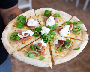 Pizza slices with figa and salads homemade tasty, italian.