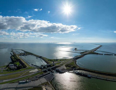 Aerial image of the Dutch afsluitdijk, a man made dike construction between Noord-Holland and Friesland, acting as flood protection barrier and segregating the IJsselmeer from the North Sea