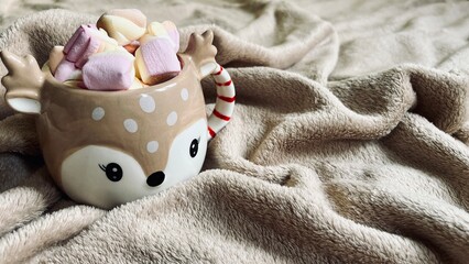 hot chocolate with marshmallows in the shape of a Christmas deer