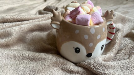 hot chocolate with marshmallows in the shape of a Christmas deer
