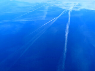 Blue Skys With Aeroplan condensation trails Contails in White Smoke for Background