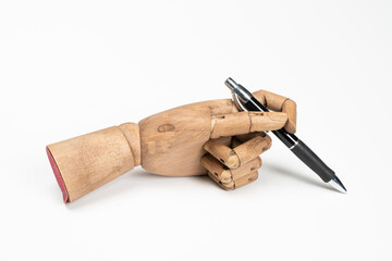 a pen in a wooden hand